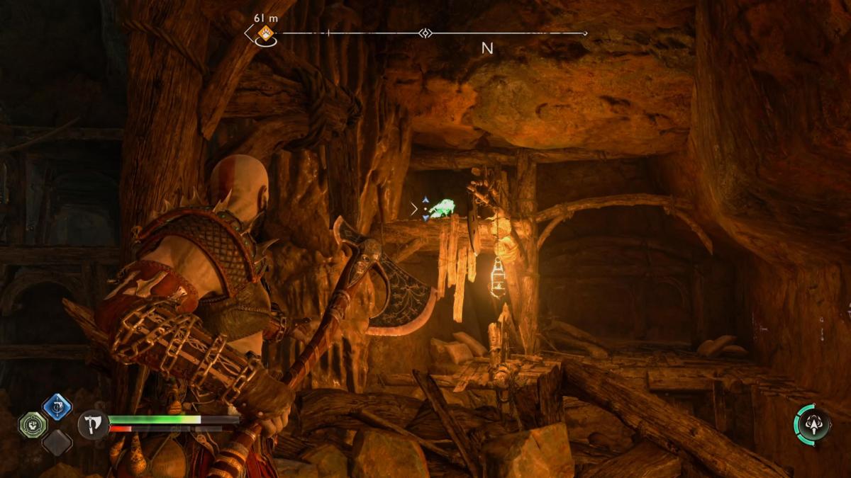 A raven hides in a cave in The Applecore in God of War Ragnarok.